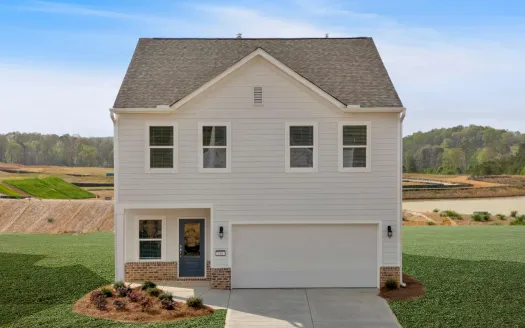 Modern two-story house with white siding, brick accents, black door, and a double garage in a suburban setting.